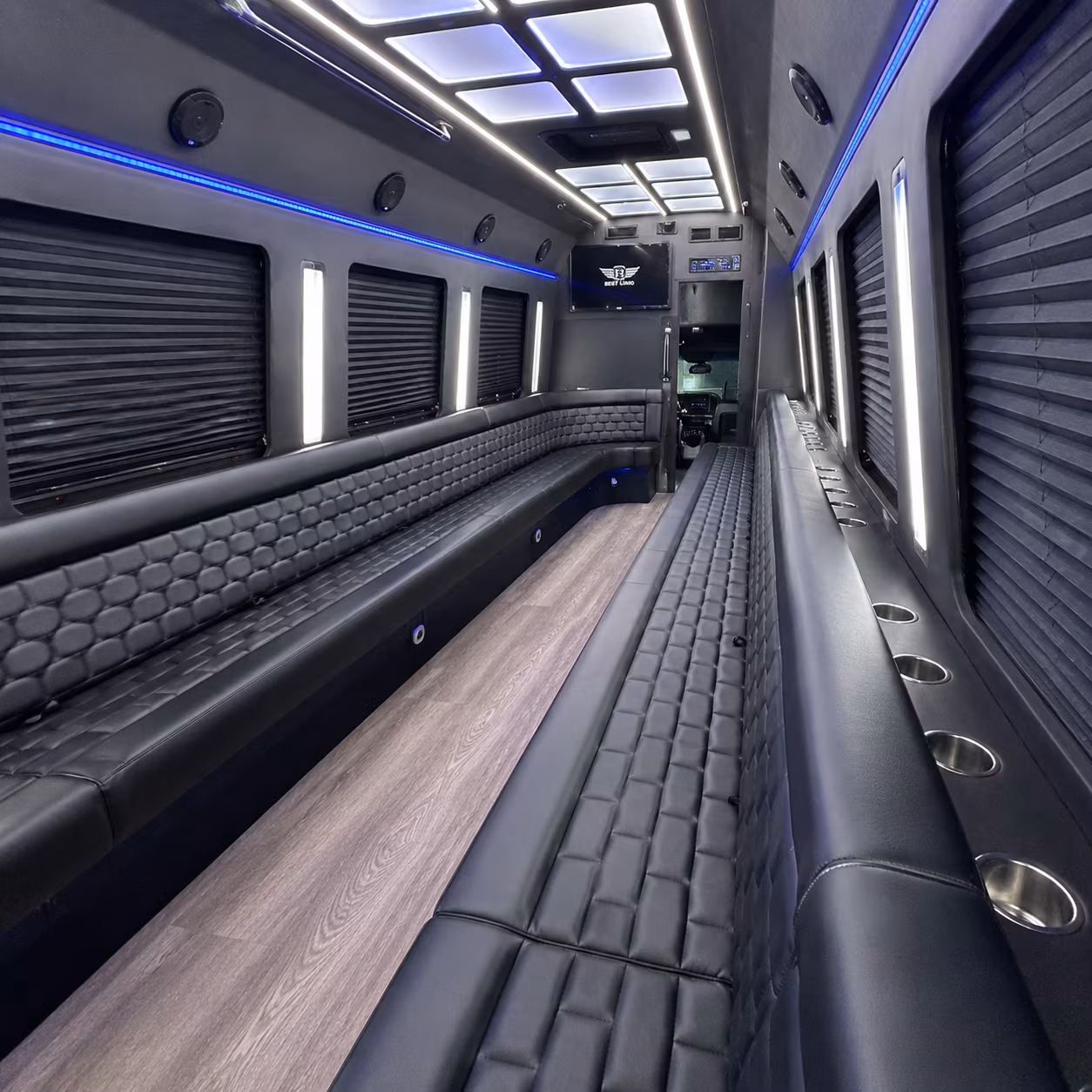 Wedding guests seated inside a party bus serving Newark